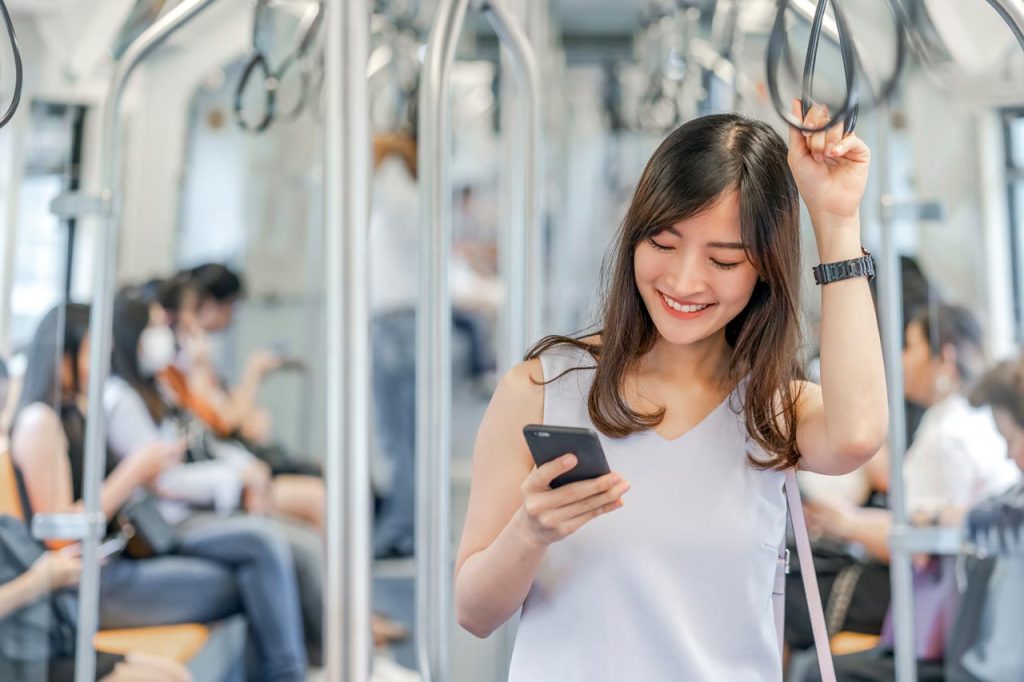 Young Woman commuting by public transport